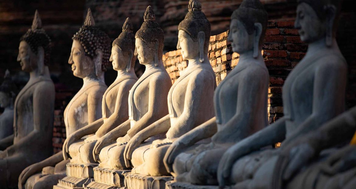 sitting-buddha-statues-at-wat-yai-chai-mongkhon-GTD695P.jpg